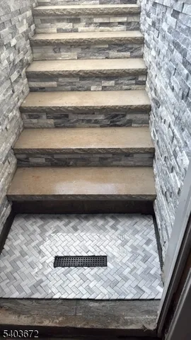 a kitchen with a refrigerator and a stove top oven