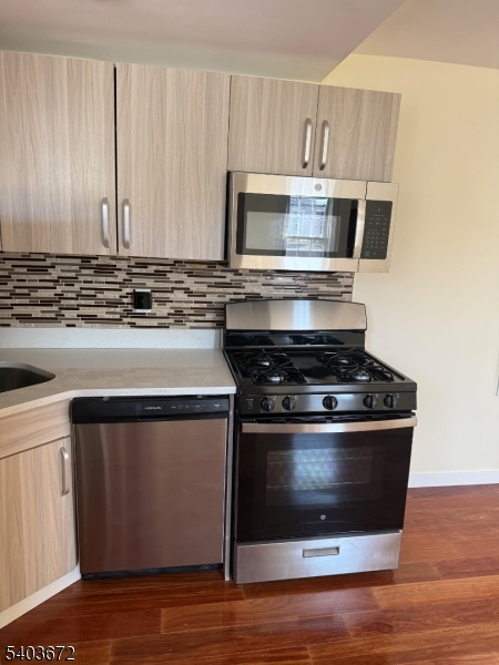 863 Lafayette Street Elizabeth, NJ 07201 - Photo 8 of 20 a stove top oven sitting inside of a kitchen