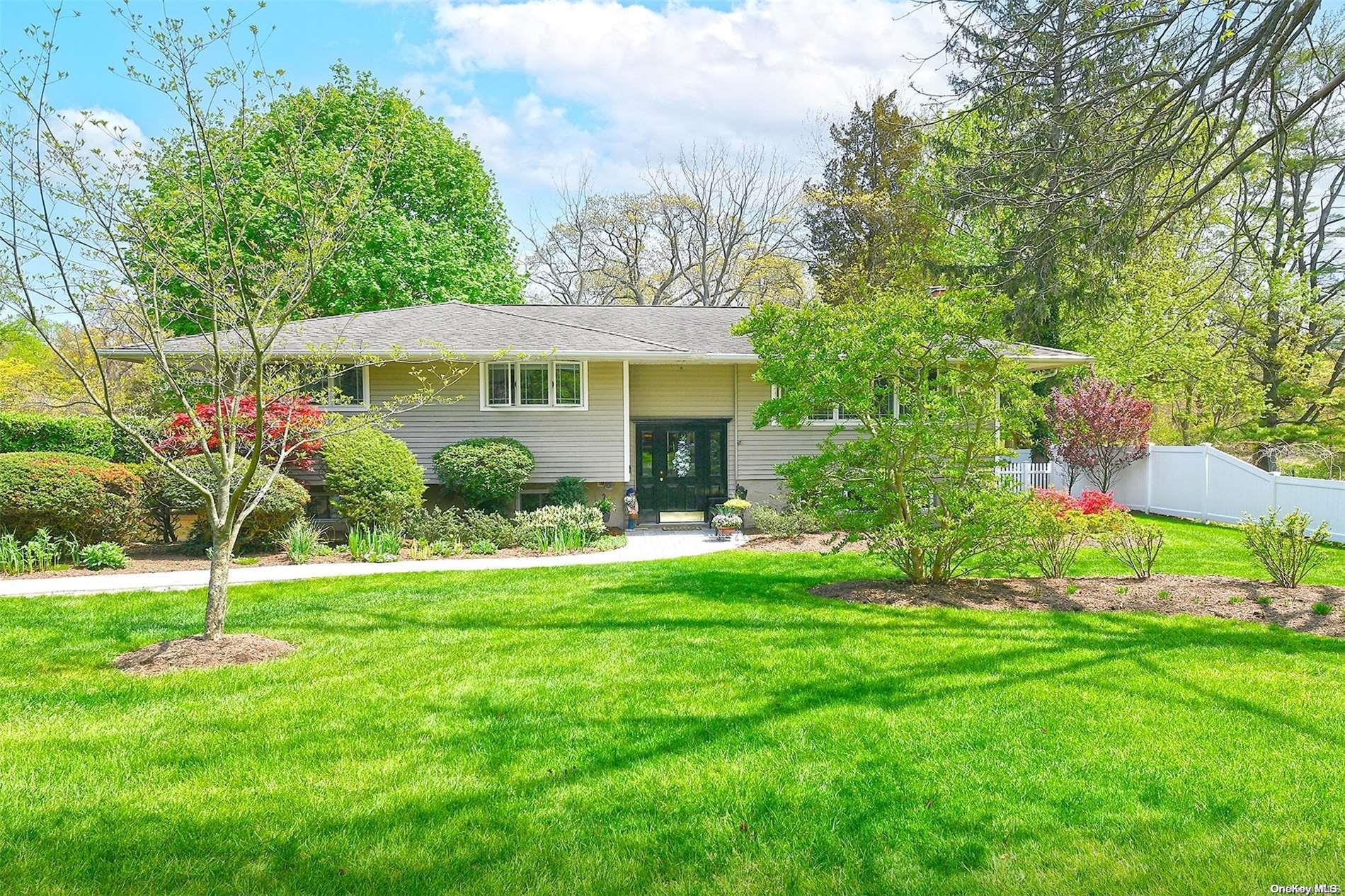 63 Eatons Neck Road Northport, NY 11768 - Photo 1 of 1 a view of a house with a big yard plants and large trees