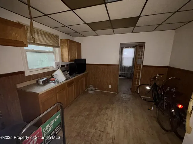 a kitchen with granite countertop a sink and a stove