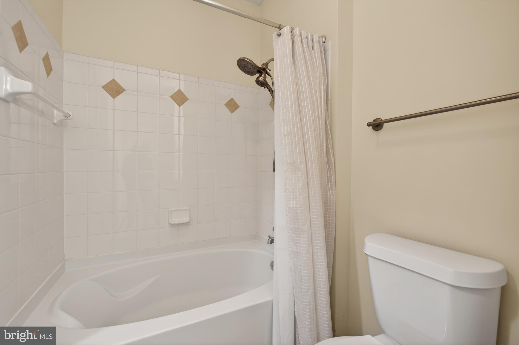 31 Booth Street, Unit 358 Gaithersburg, MD 20878 - Photo 15 of 20 a bathroom with a shower and a toilet