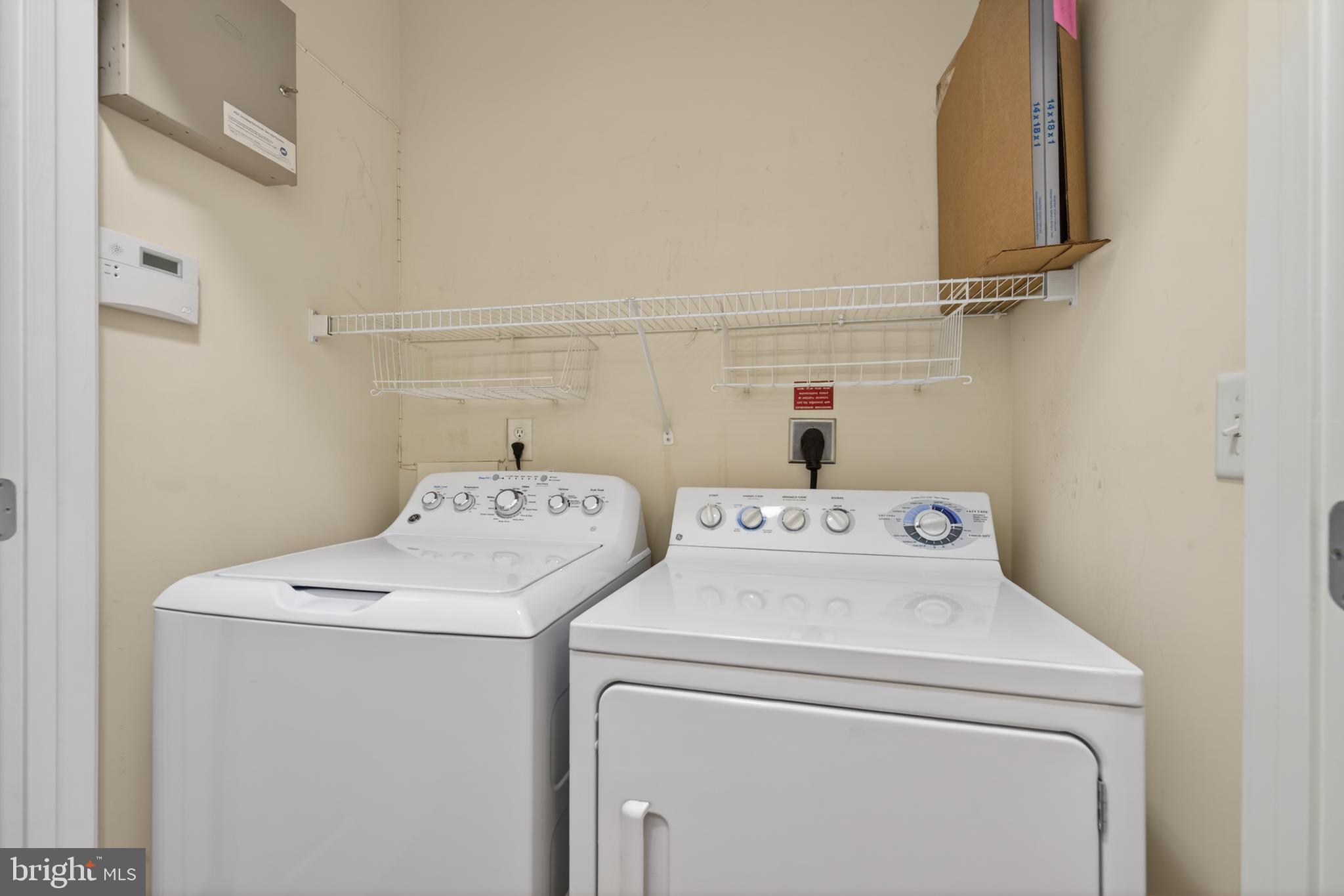 31 Booth Street, Unit 358 Gaithersburg, MD 20878 - Photo 18 of 20 a utility room with dryer and washer