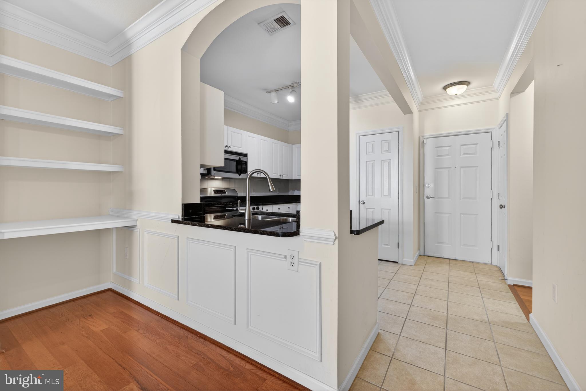 31 Booth Street, Unit 358 Gaithersburg, MD 20878 - Photo 4 of 20 a kitchen with stainless steel appliances a refrigerator and cabinets
