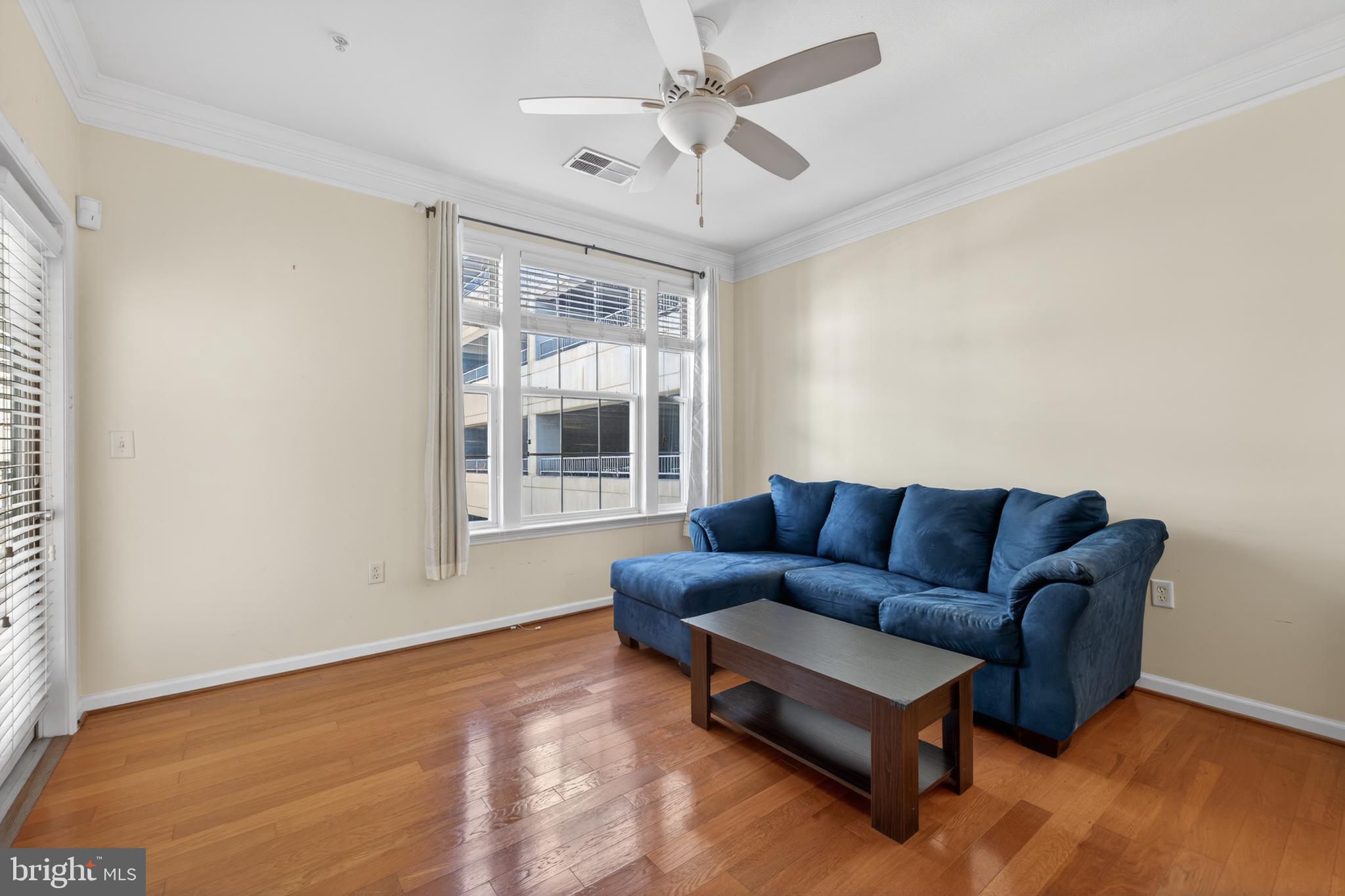 31 Booth Street, Unit 358 Gaithersburg, MD 20878 - Photo 7 of 20 a living room with furniture and a window