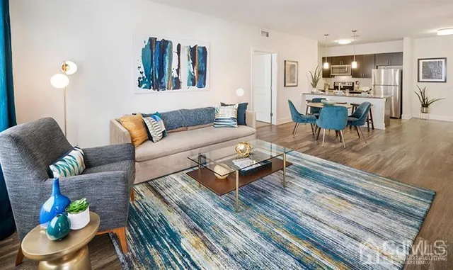 a living room with furniture and a large window