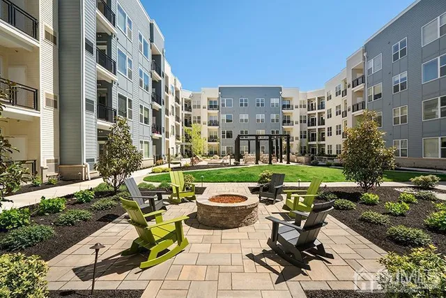 a building view with swimming pool and sitting space