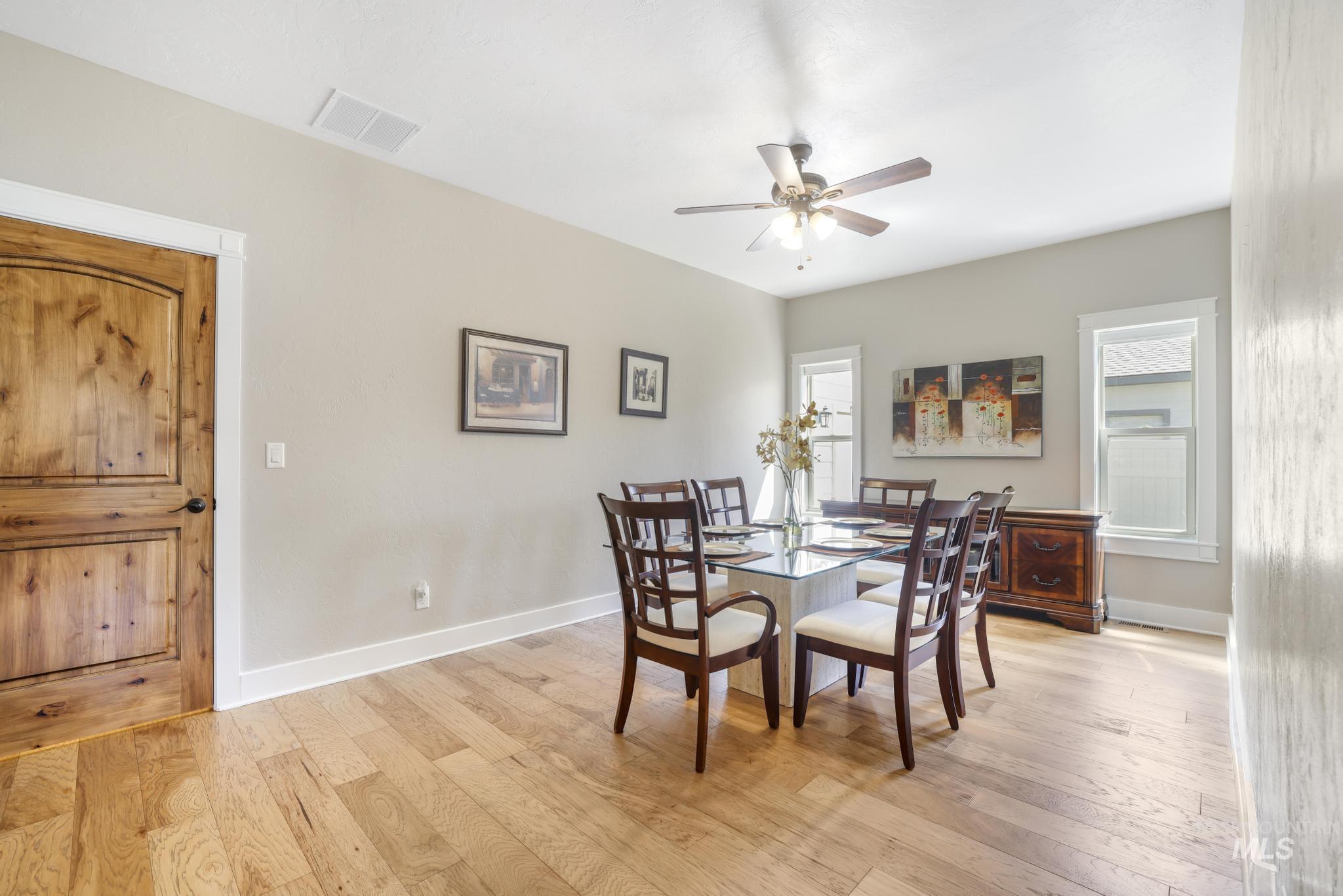 2157 Cayuse Street Twin Falls, ID 83301 - Photo 17 of 48 Dining room featuring light wood finished floors and a ceiling fan