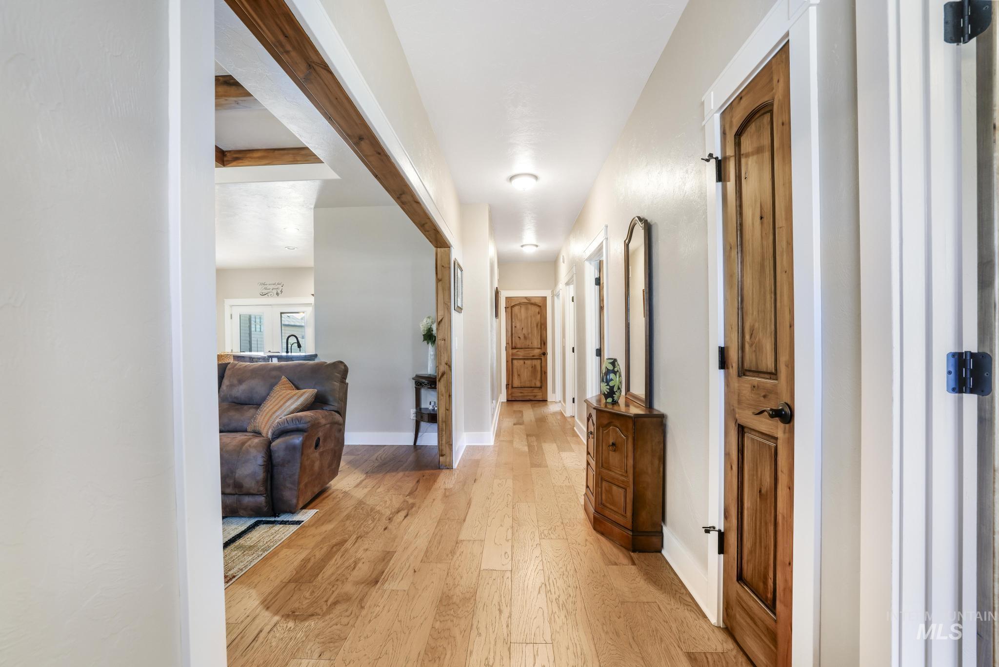 2157 Cayuse Street Twin Falls, ID 83301 - Photo 21 of 48 Corridor featuring light wood-style floors and beamed ceiling
