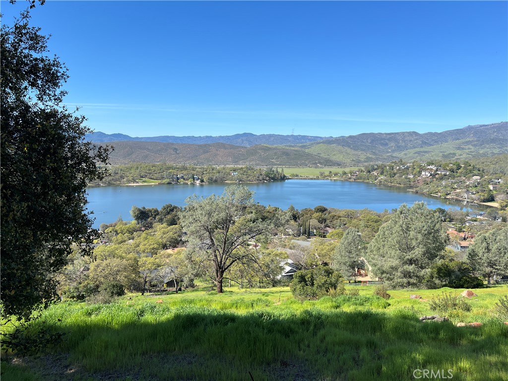 17282 Greenridge Road Hidden Valley Lake, CA 95467 - Photo 2 of 7 a view of a lake with houses in the background