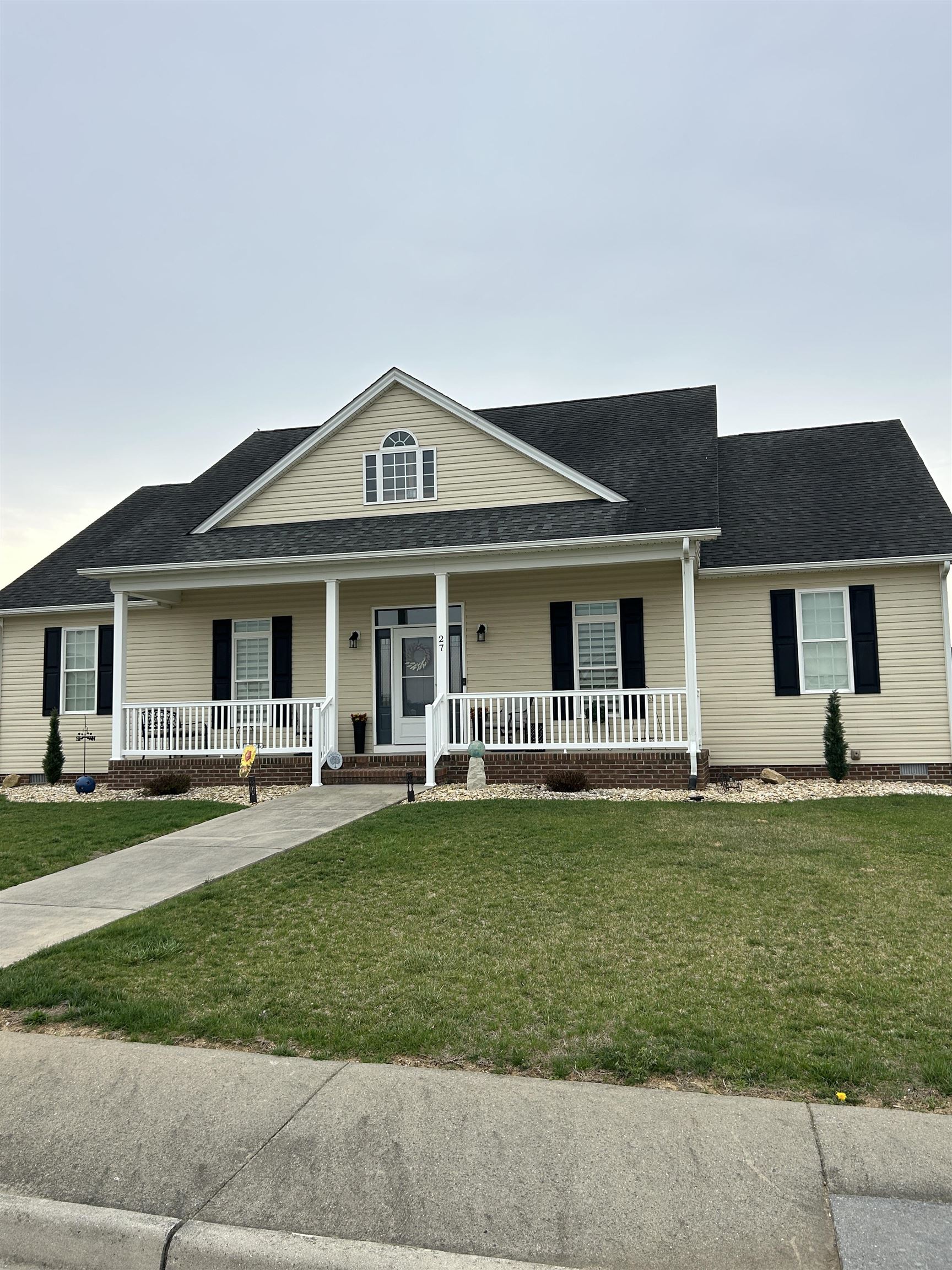 27 Slate Drive Stuarts Draft, VA 24477 - Photo 19 of 40 a front view of a house with a garden and trees