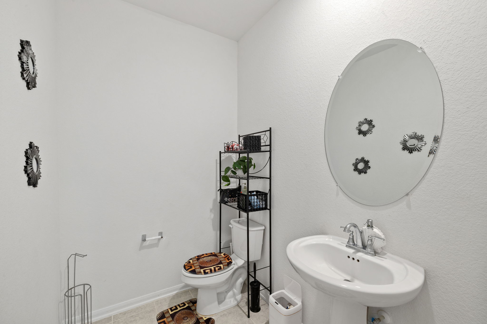 189 Durian Loop Buda, TX 78610 - Photo 29 of 38 Half bathroom with toilet and tile patterned flooring
