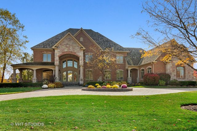 a front view of building with yard