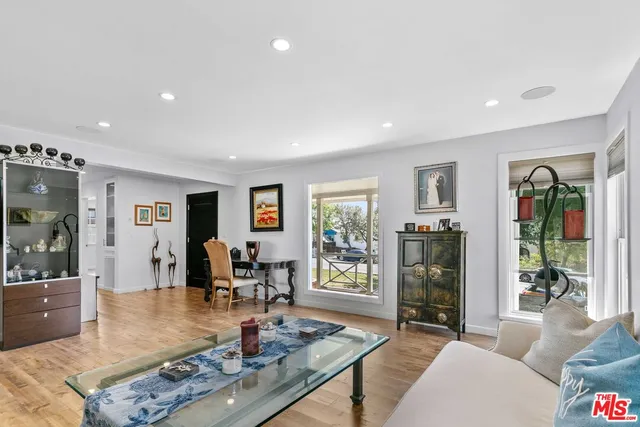 a living room with furniture and a table