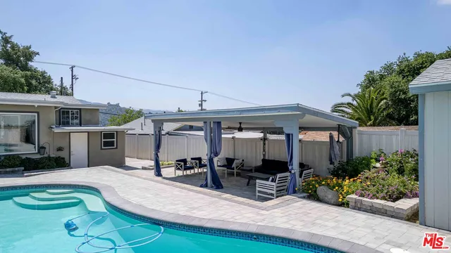 a view of a house with porch and sitting area