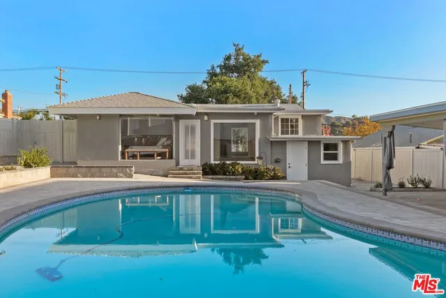 a view of a house with a swimming pool