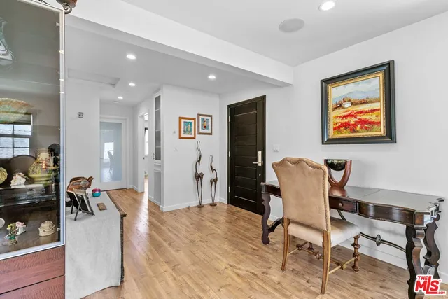 a workspace with furniture and wooden floor