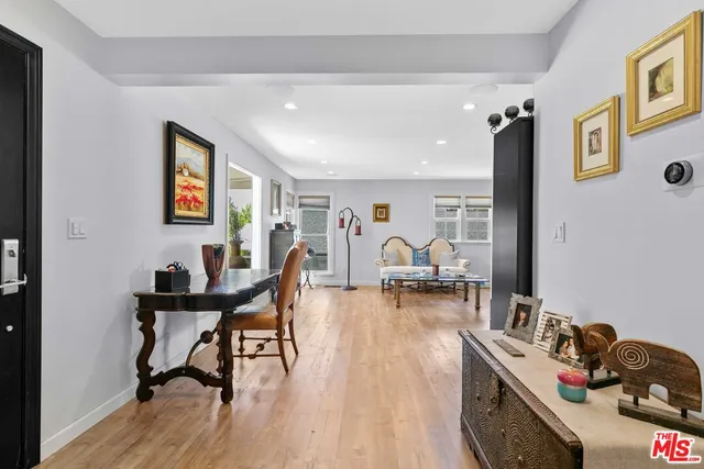 a workspace with furniture and wooden floor
