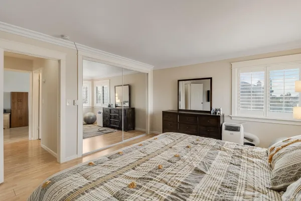 a bed room with a bed and a television