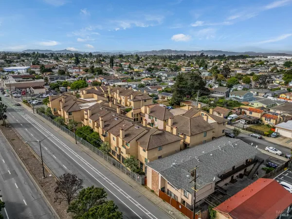 a kitchen with granite countertop a sink and a stove