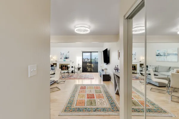a living room with furniture and a rug