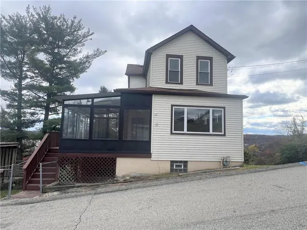 a front view of a house with a garage