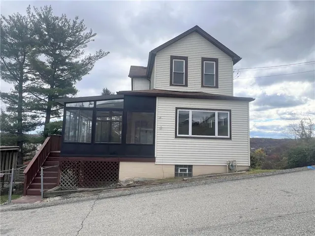 a front view of a house with a garage