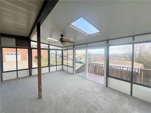 a view of an empty room with windows