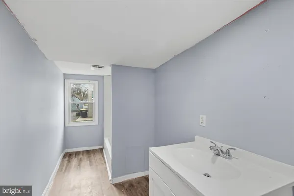 a bathroom with a sink and a bathtub