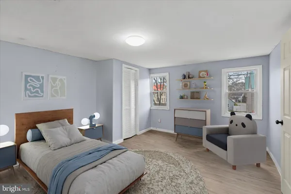 a spacious bedroom with a bed and a couch