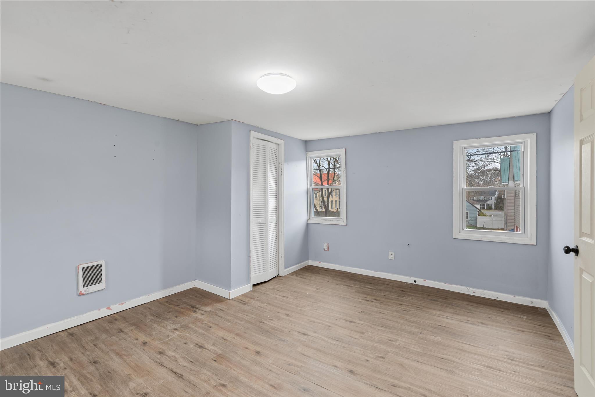 304 East 5th Street Laurel, DE 19956 - Photo 20 of 30 a view of an empty room with wooden floor and a window