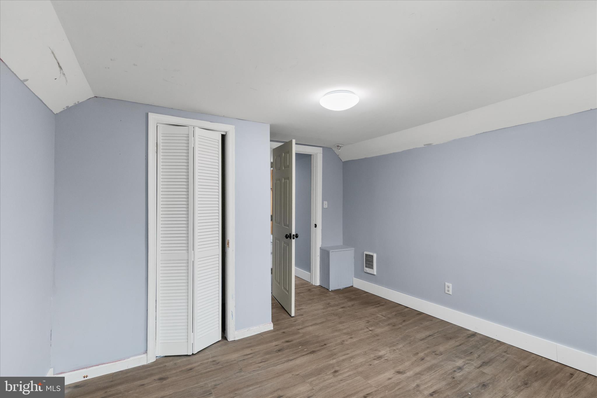 304 East 5th Street Laurel, DE 19956 - Photo 23 of 30 a view of an empty room with wooden floor and closet
