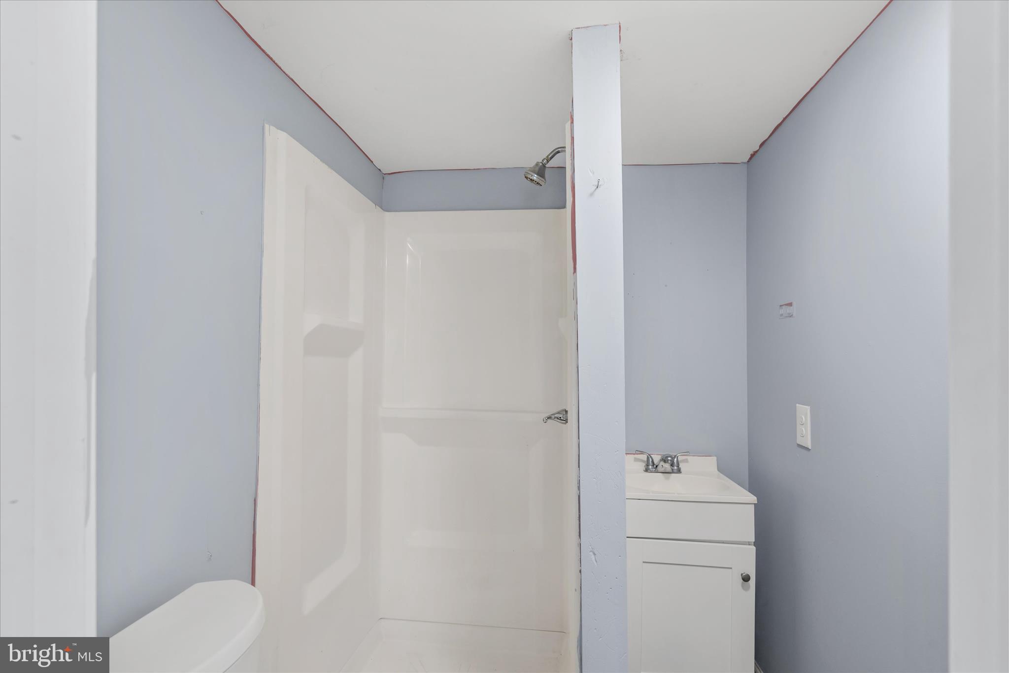 304 East 5th Street Laurel, DE 19956 - Photo 24 of 30 a bathroom with a toilet and a shower