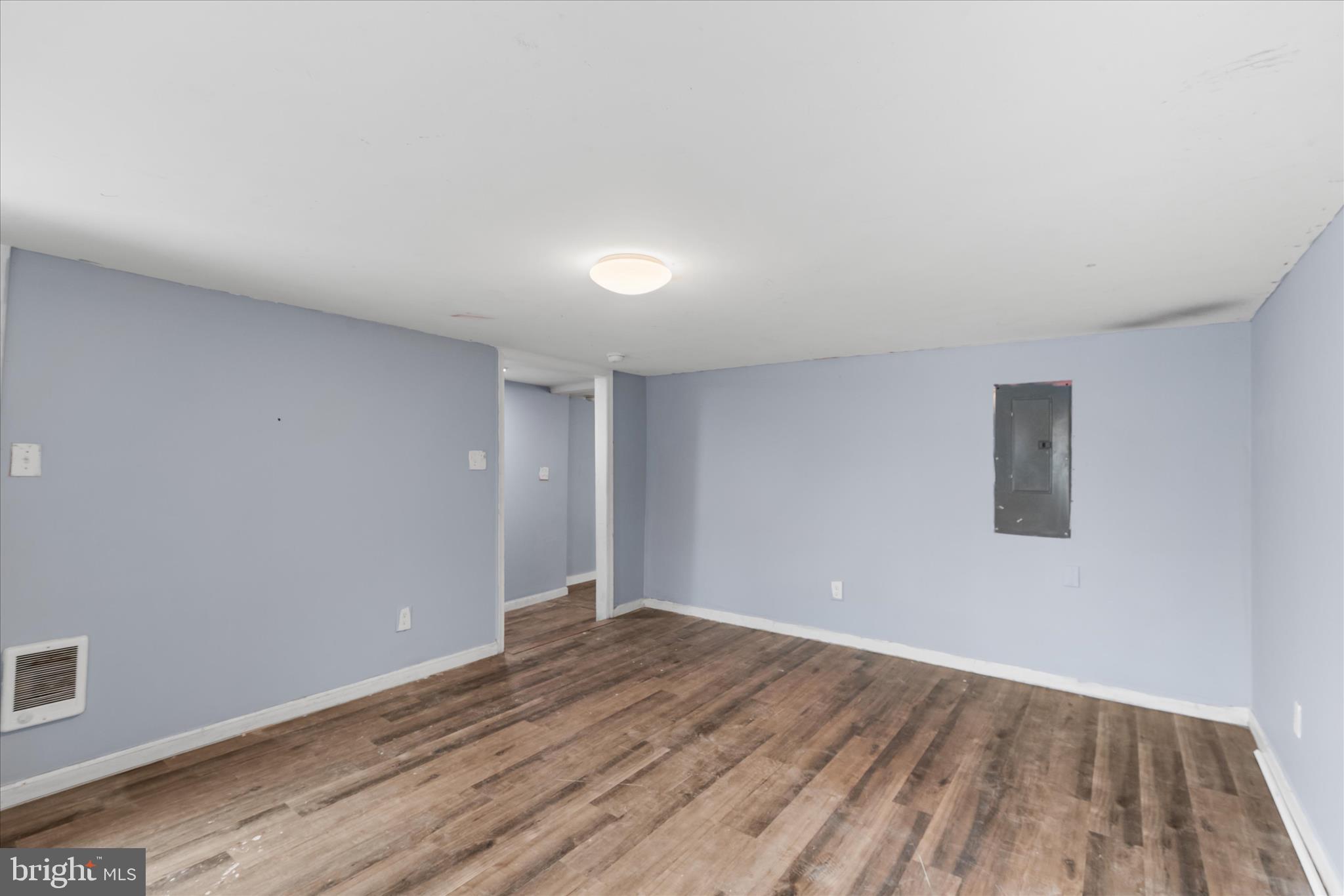 304 East 5th Street Laurel, DE 19956 - Photo 7 of 30 a view of an empty room with wooden floor