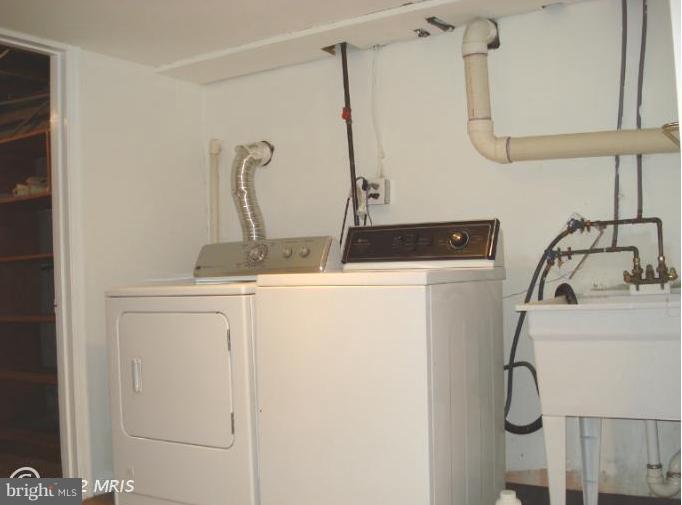 9610 Wire Avenue Silver Spring, MD 20901 - Photo 4 of 23 a bathroom with a sink and mirror