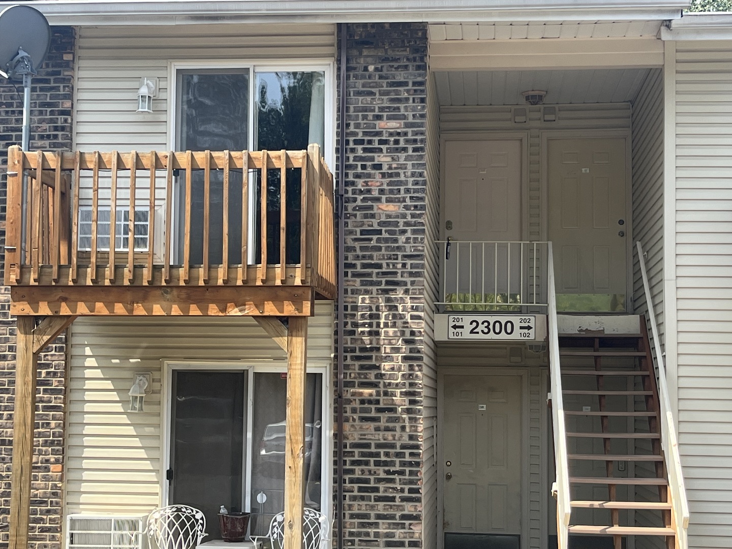 2300 Light Road, Unit 201 Oswego, IL 60543 - Photo 1 of 10 a view of a building with a door and a window