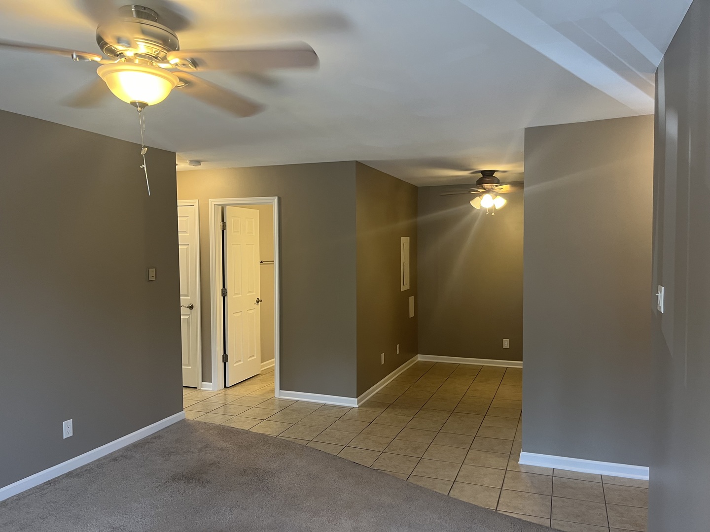 2300 Light Road, Unit 201 Oswego, IL 60543 - Photo 3 of 10 wooden floor in an empty room with a bathroom
