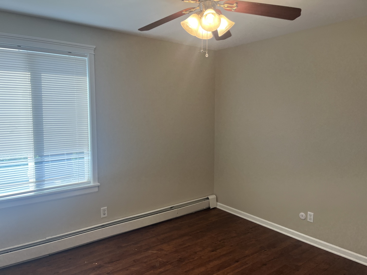 2300 Light Road, Unit 201 Oswego, IL 60543 - Photo 9 of 10 an empty room with wooden floor and windows