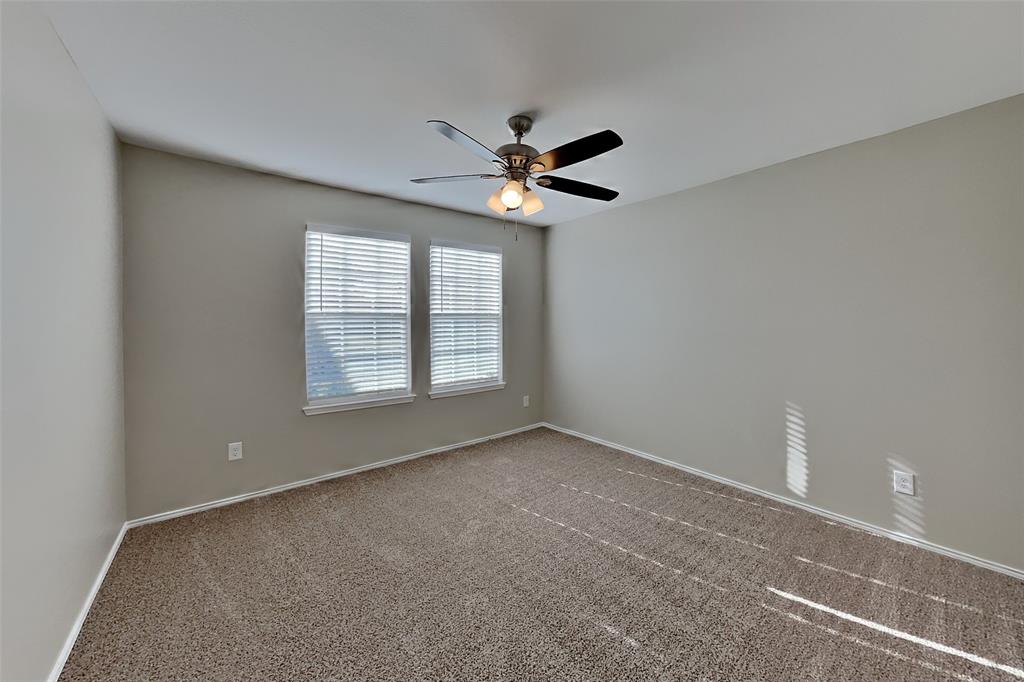 5804 Mirror Ridge Drive Fort Worth, TX 76179 - Photo 12 of 19 an empty room with windows and fan