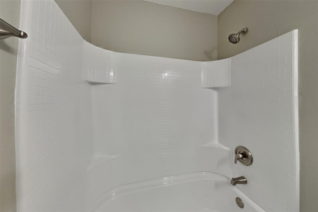 5804 Mirror Ridge Drive Fort Worth, TX 76179 - Photo 17 of 19 a bathroom with a bathtub