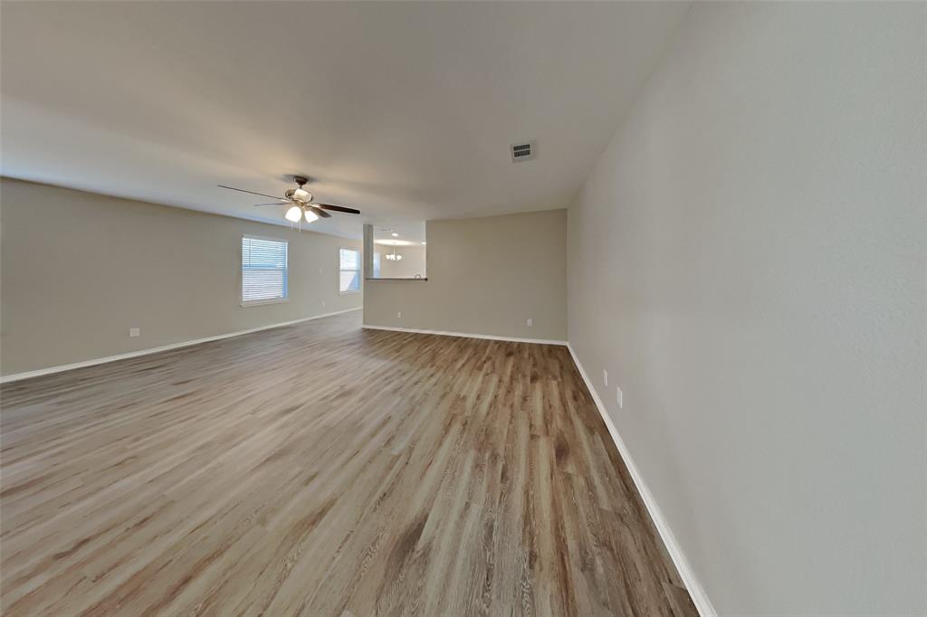 5804 Mirror Ridge Drive Fort Worth, TX 76179 - Photo 3 of 19 a view of wooden floor and chandelier in closet