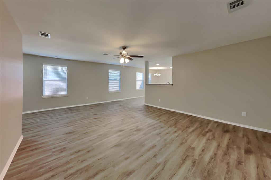 5804 Mirror Ridge Drive Fort Worth, TX 76179 - Photo 4 of 19 wooden floor in an empty room with a window