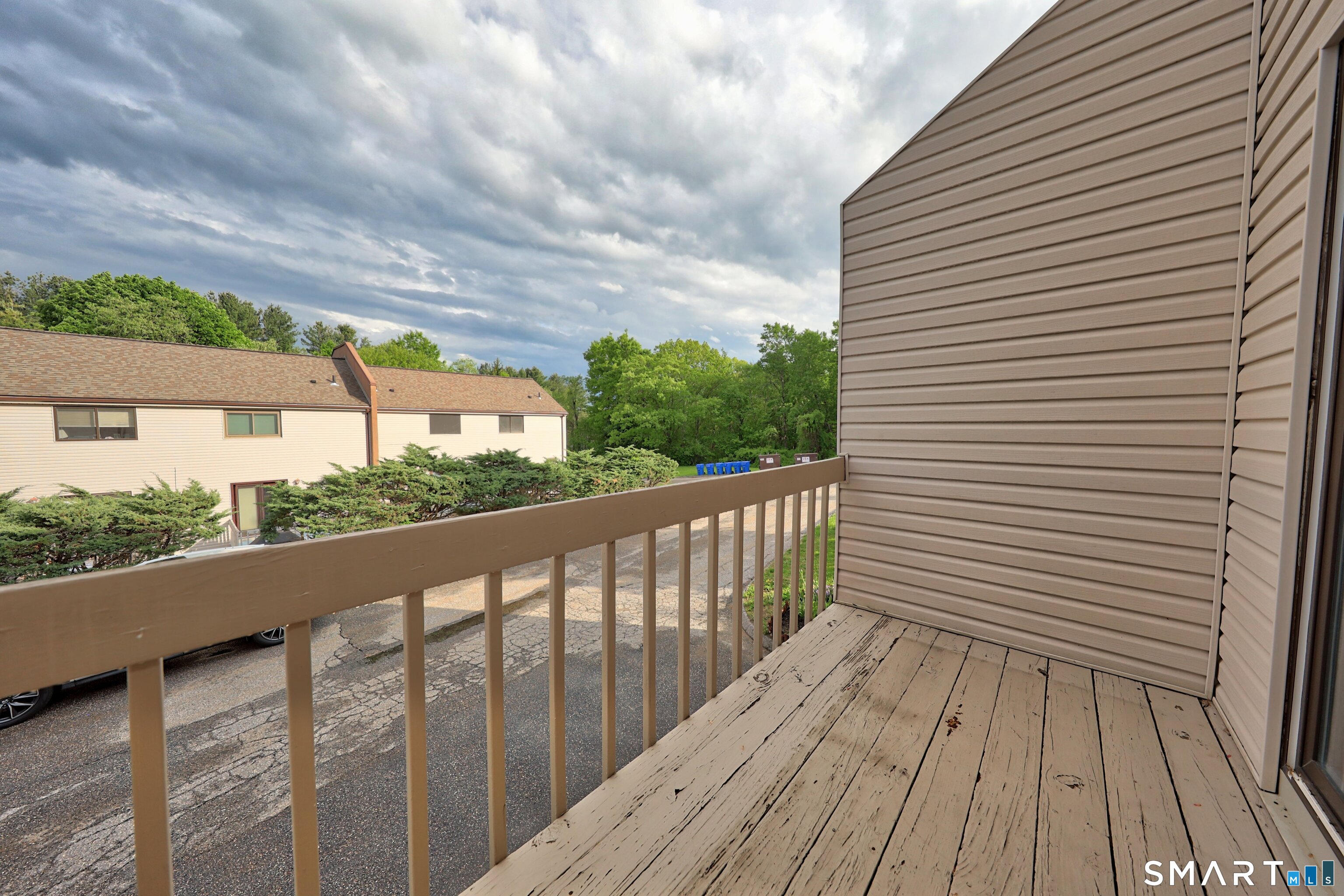 349 Allen Road, Unit 34C Torrington, CT 06790 - Photo 22 of 31 a view of a balcony with wooden floor