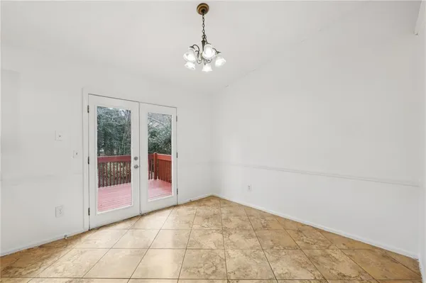 a view of an empty room with glass door
