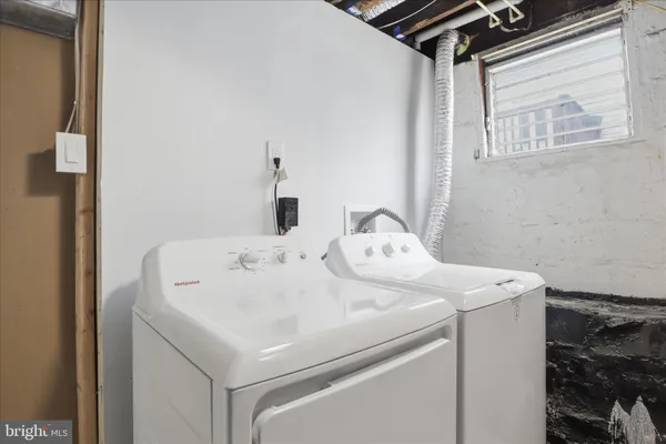 a utility room with dryer and washer