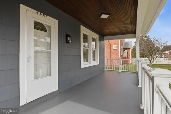 a view of a hallway with a porch