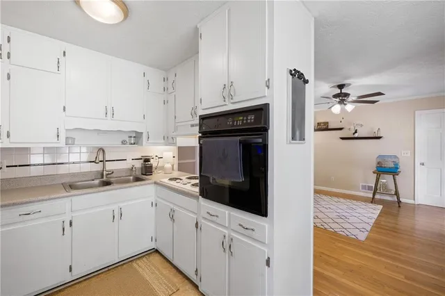 a kitchen with cabinets and appliances