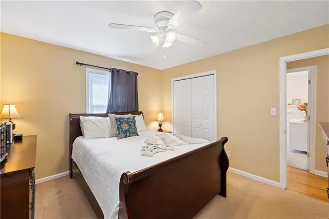 a bed room with a bed and a chandelier