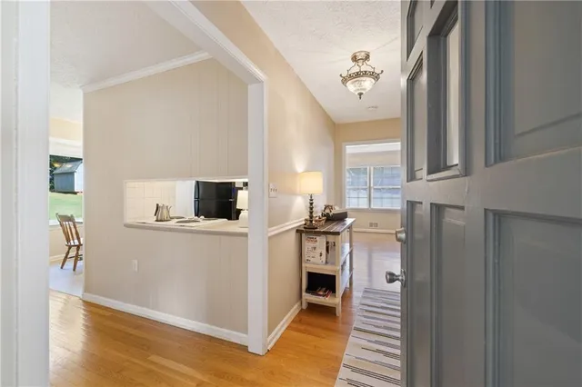 a kitchen with stainless steel appliances a stove top oven and a refrigerator