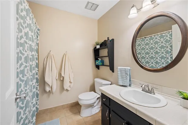 a bathroom with a toilet and a sink