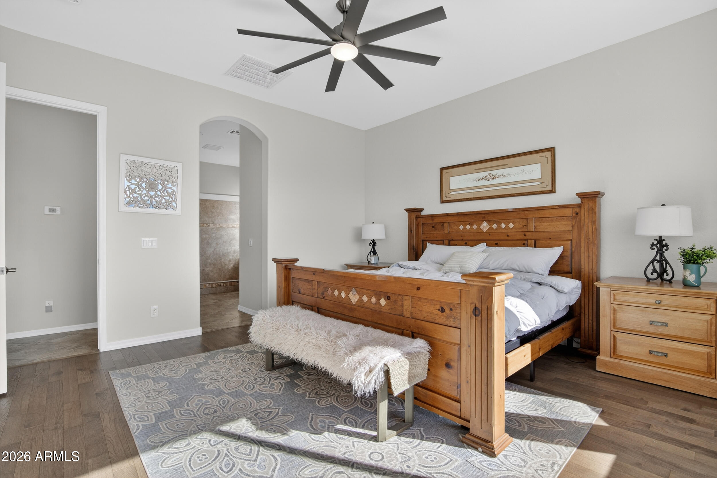 18377 Verdin Road Goodyear, AZ 85338 - Photo 12 of 55 a bedroom with a bed and a mirror